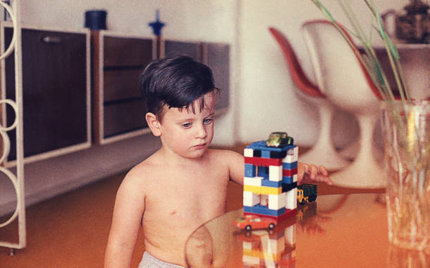 istock Vintage boy playing at home 913362874