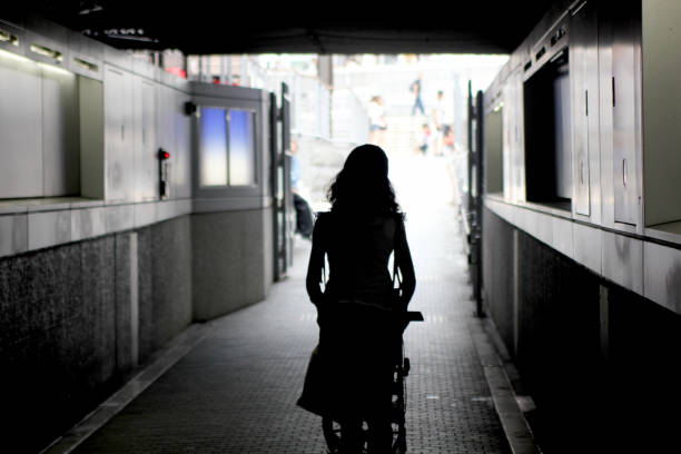 istock through tunnel, silhouette, to the light 913363350