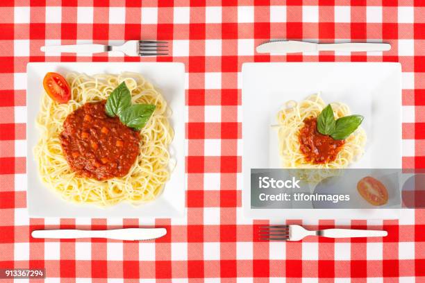 Large And Tiny Food Portions Stock Photo - Download Image Now - Serving Size, Small, Scale
