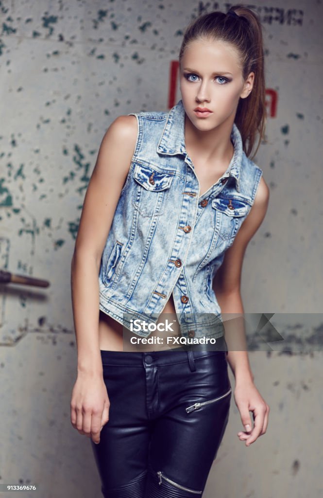 Young Fashionable Model In Latex And Jeans Jacket Stock Photo - Image Now - iStock