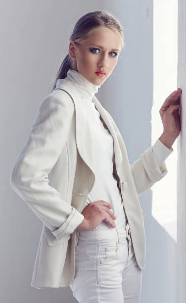 istock Blue eyes woman in a white spring clothes. 913369892