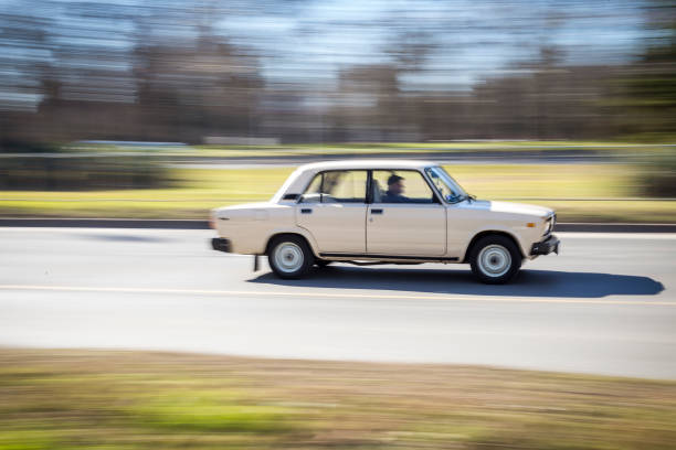 istock old Russian car of the last century moves at a fast pace. blurring effect. 913369920