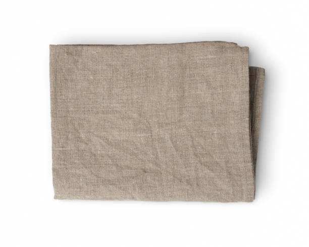 istock Used rumpled folded linen kitchen towel isolated on white background 913374426
