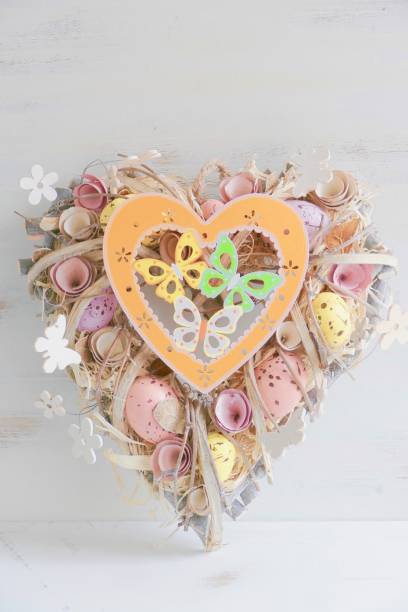 istock Heart shaped Valentine easter wreath with eggs and flowers, heart shape on white 913377726