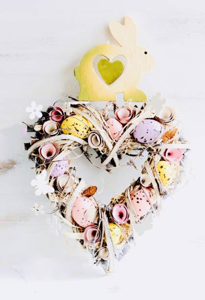 istock Heart shaped Valentine easter wreath with eggs and flowers, heart shape on white 913377778