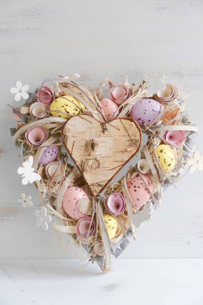 istock Heart shaped Valentine easter wreath with eggs and flowers, heart shape on white 913377842