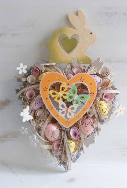 istock Valentine easter wreath with eggs and flowers, heart shape on white 913378028