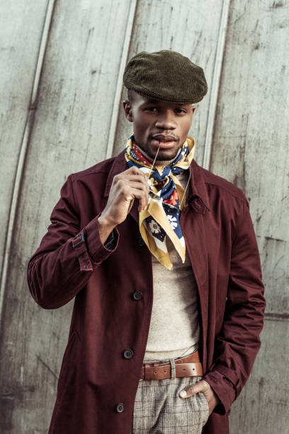 istock Stylish african american man holding sunglasses 913387406