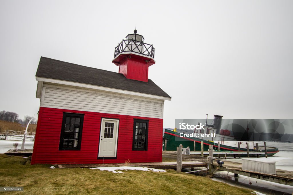 Red And White Great Lakes Lighthouse In Downtown Saugatuck Michigan The Saugatuck Lighthouse is located on the shores of the Kalmazoo River in the downtown area of the small Lake Michigan coastal town of Saugatuck. Michigan Stock Photo