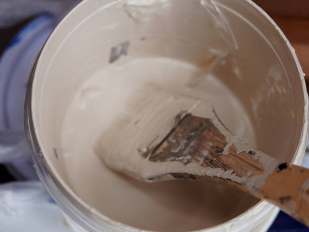 istock Paint brush in a white bucket doing street art 913396468
