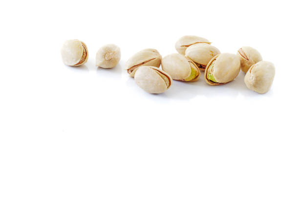 istock pistachio nut close up isolated on white background 913400046