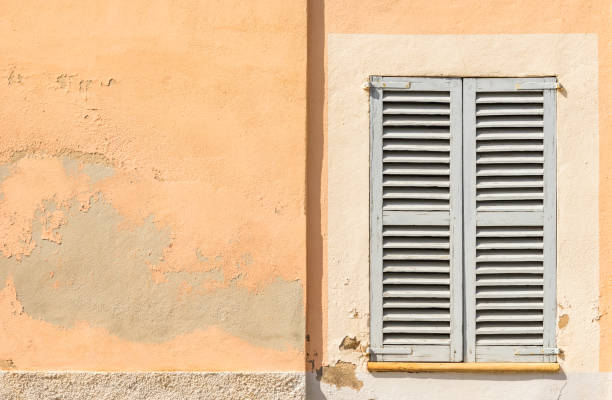 istock Gray wooden window shutters 913402562