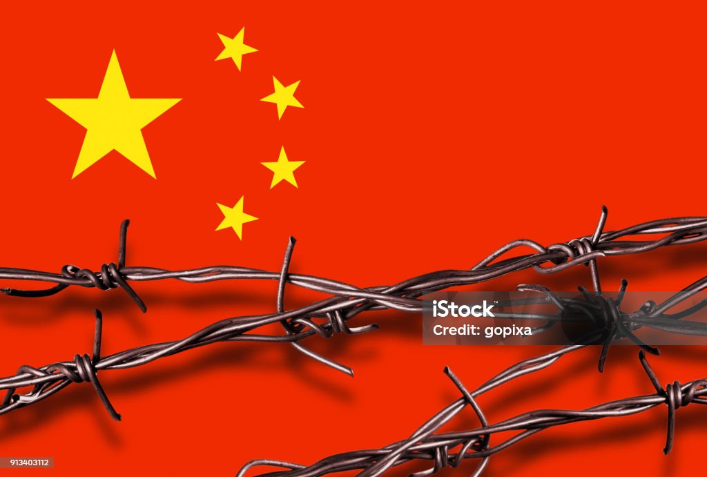 Flag of China with barbed wire Barbed wire with shadow in front of a Chinese flag China - East Asia Stock Photo