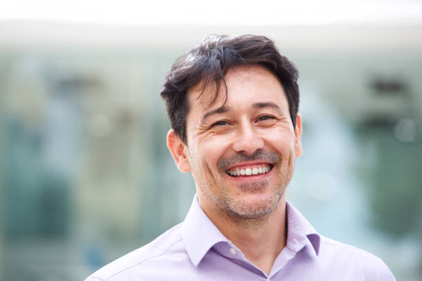 istock Close up relaxed mature man smiling outdoors 913415342