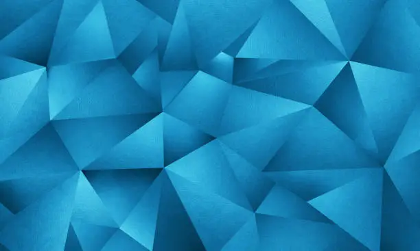 blue background image of triangle geometric shapes in a vector style but constructed of multiple layers of textured art paper to give a natural texture with actual photographic images