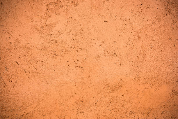 istock Hand painted red ohra Moroccan wall background 913418584