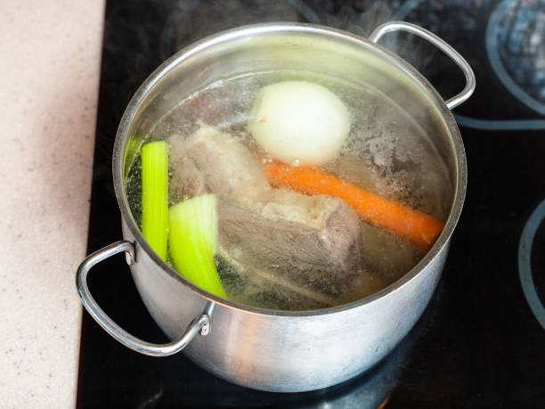 istock simmering beef broth in stockpot on ceramic cooker 913418836