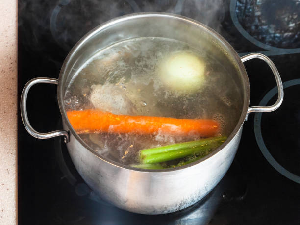 istock boiling meat stock in stockpot on ceramic cooker 913419196