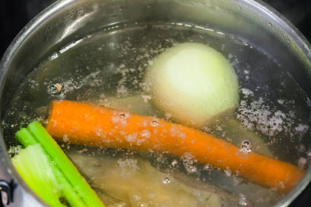 istock boiling meat broth in steel stewpan close up 913422292