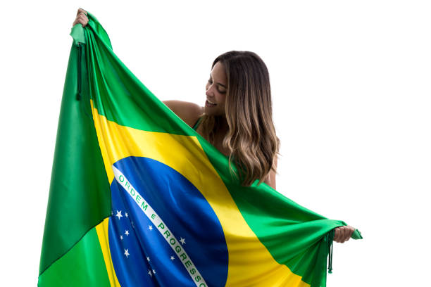 istock Brazilian female fan celebrating on white background 913422920