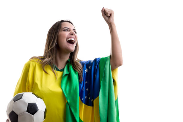 istock Brazilian female fan celebrating on white background 913422982