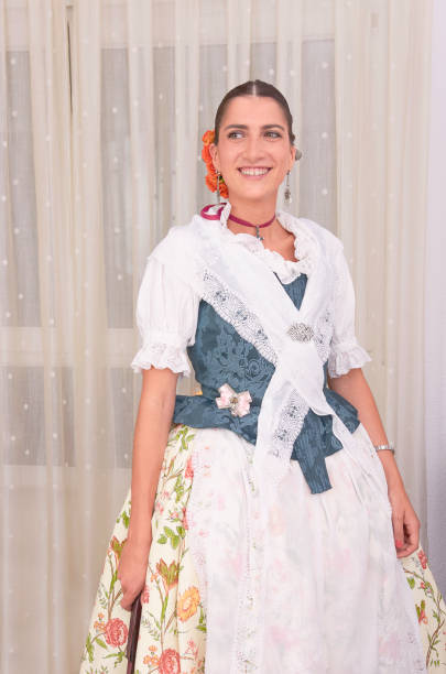 istock Beautiful woman is wearing a regional customes 913423428