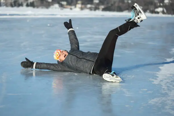 Photo of Woman on the ice after a fall