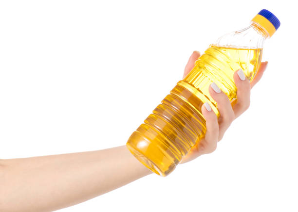 istock A bottle sunflower oil in hand 913426112