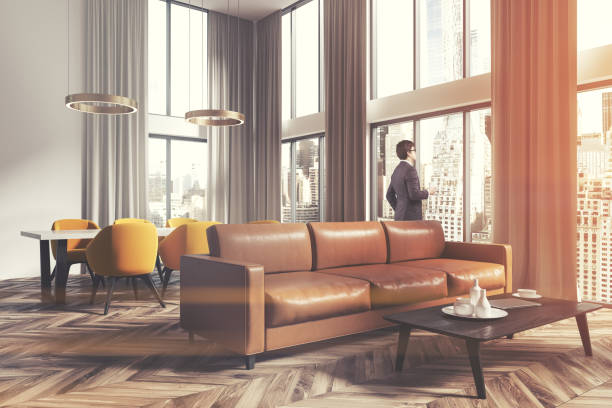 istock Living room and dining room corner brown man 913430432