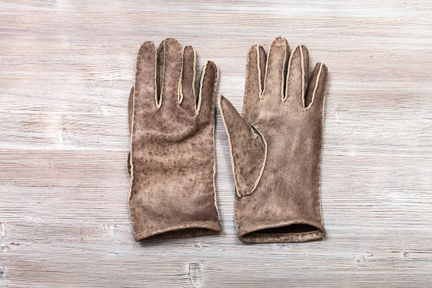 istock new hand-made stitched gloves on table 913431388