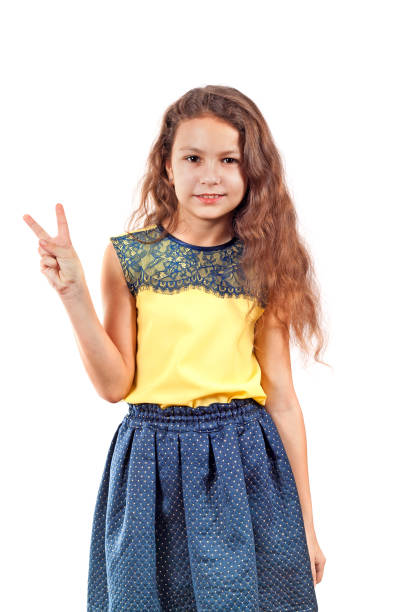 istock Girl showing a V with her fingers 913438094