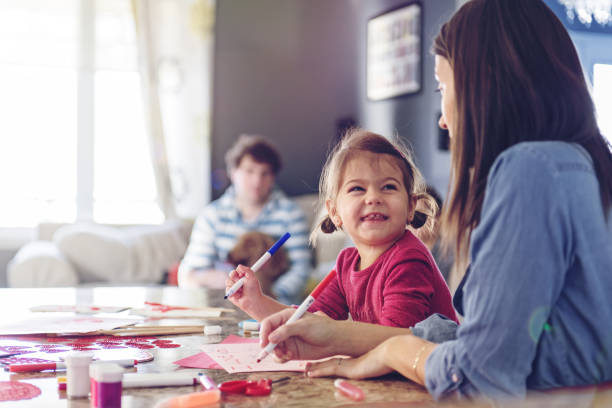 Valentine's Day, mother making valentine cards