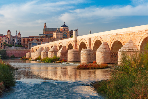 Great Mosque Mezquita - Catedral de Cordoba and Roman bridge across Guadalquivir river in the morning, Cordoba, Andalusia, Spain