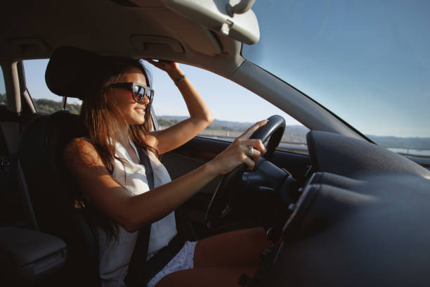 istock Attractive brunette drives a car 913445902