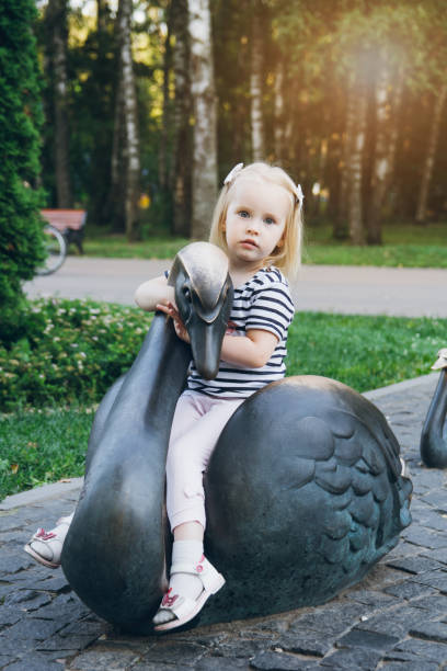 istock Little girl walking in a summer Park 913448906