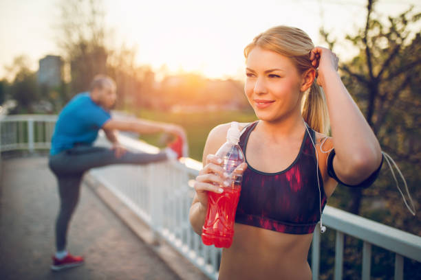 istock Young people stretching after jogging in an urban environment 913460580