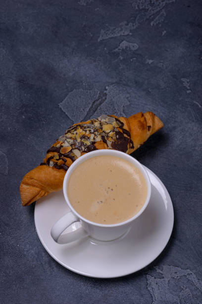 istock Cup cappuccino and croissant 913465056