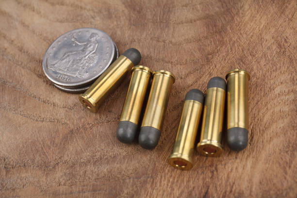 istock Cartridges and Silver Dollar Wild West period 913469808
