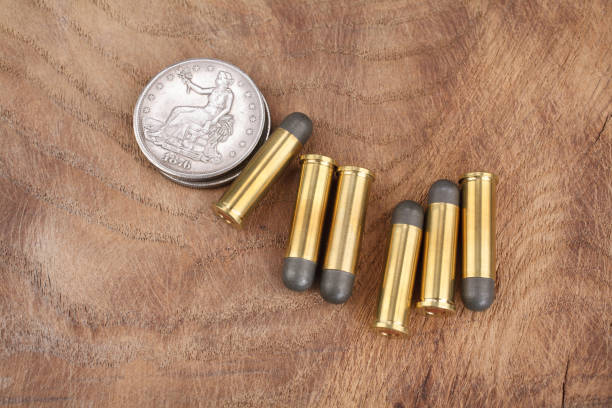 istock Cartridges and Silver Dollar Wild West period 913470506
