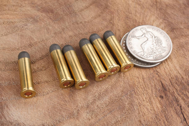 istock Cartridges and Silver Dollar Wild West period 913470830