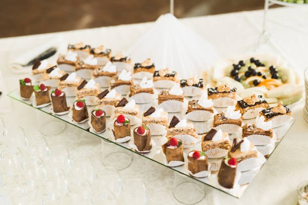 istock Delicious sweets on wedding candy buffet with desserts, cupcakes 913476258
