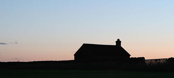 istock Stone farm house silhouette at sunrise 91347986
