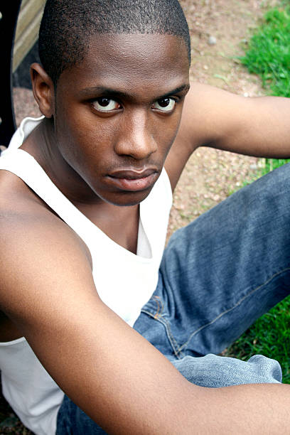 istock Young Black Man Sitting in Park 91348039