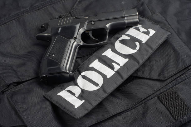 istock Police uniform with handgun and ammunition 913481964