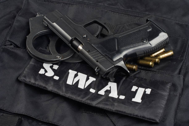 istock SWAT uniform with handgun and ammunition 913482108