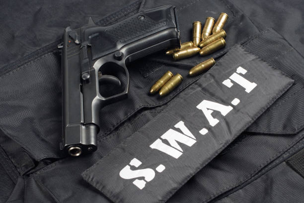 istock SWAT uniform with handgun and ammunition 913482394
