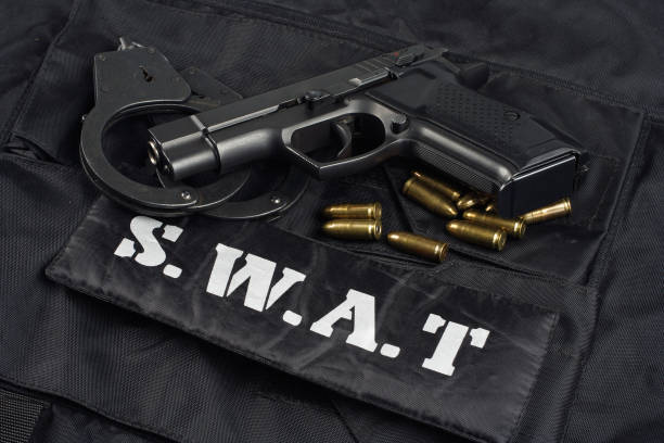 istock SWAT uniform with handgun and ammunition 913482606