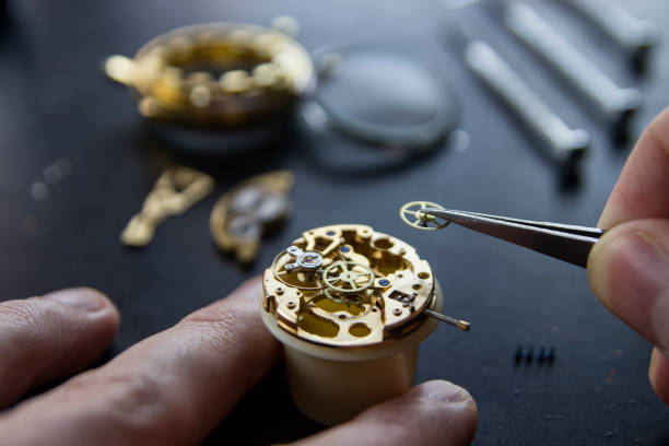 istock Process of installing a part on a mechanical watch, watch repair 913482644