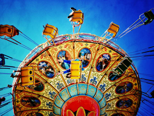 istock filtered image of an amusement park swing ride 913489562
