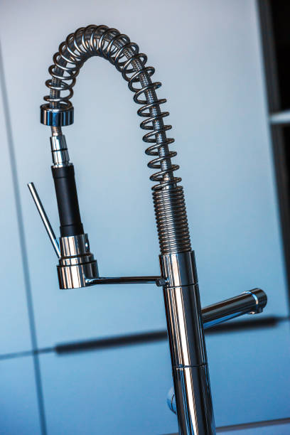 istock Modern faucet with a water saver 913492468
